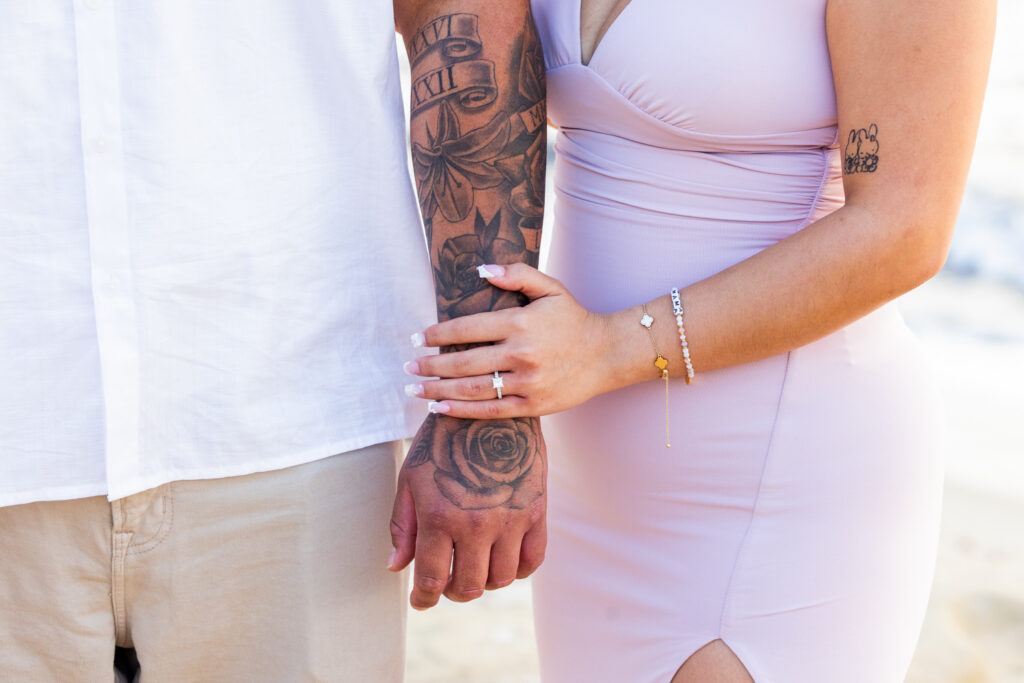 A Low-Key La Jolla Proposal with 50 Red Roses and Family Waiting Nearby proposal photographer in san diego 4